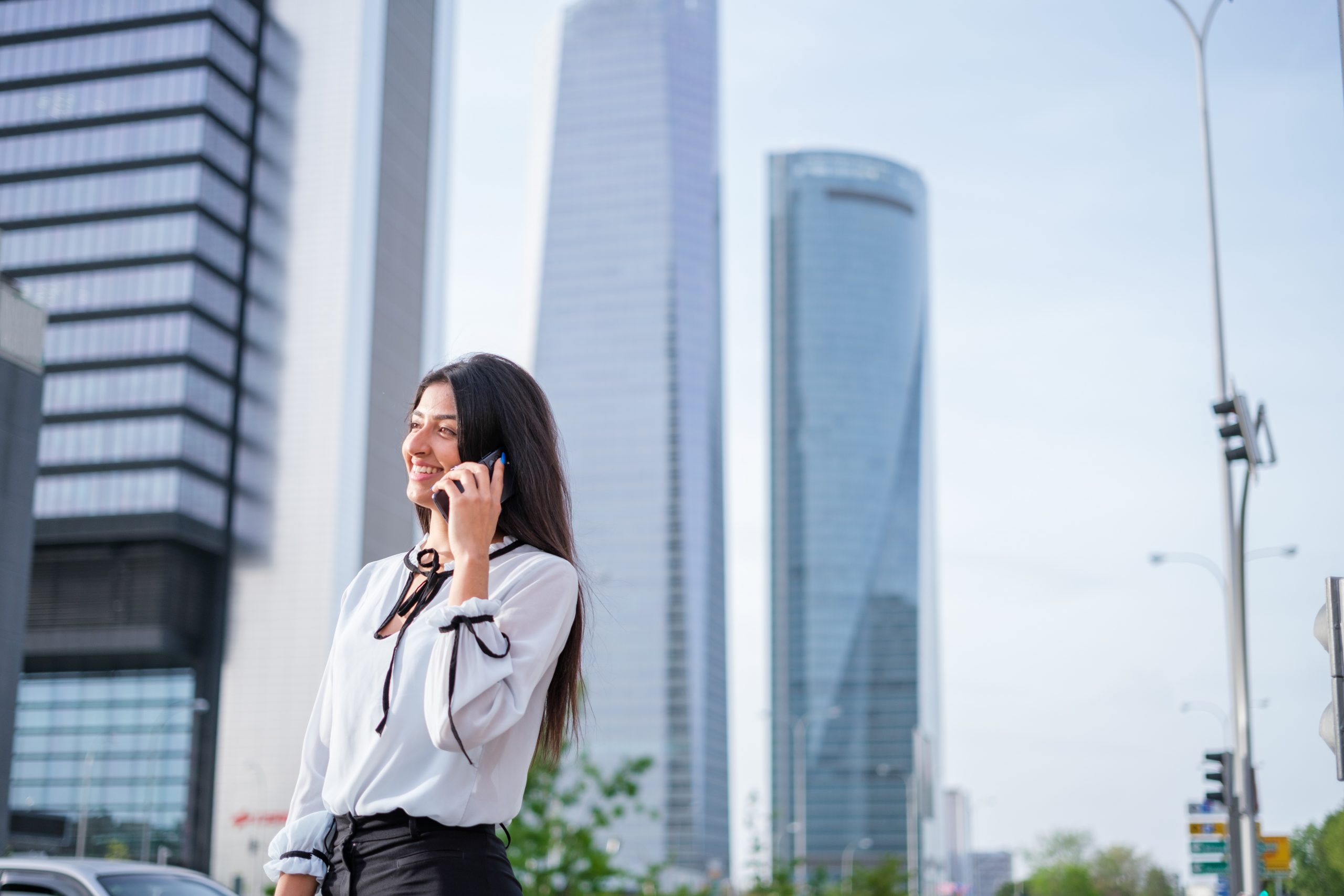 Businesswoman,Talking,On,The,Phone,In,Financial,District